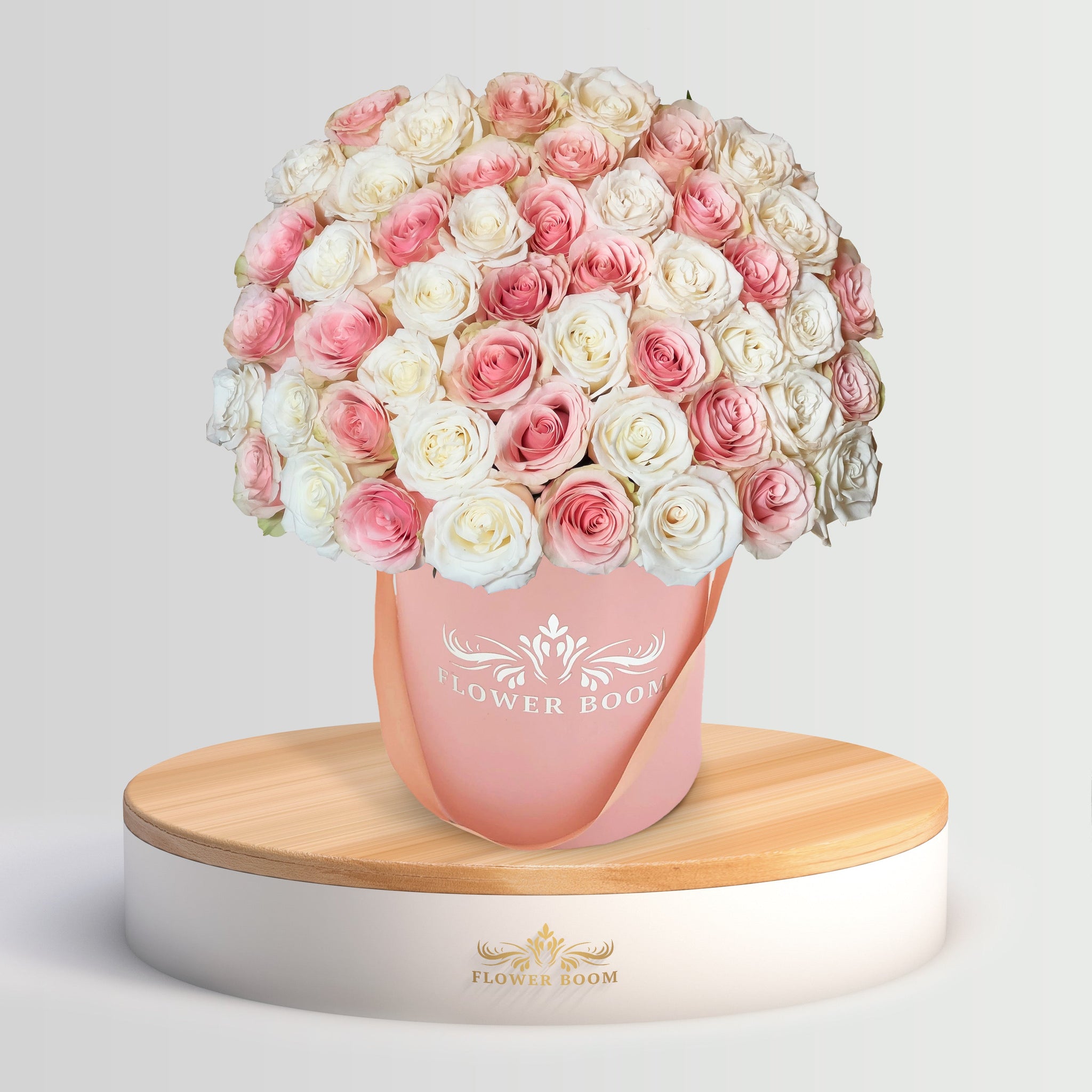 pink and white roses in a pink box