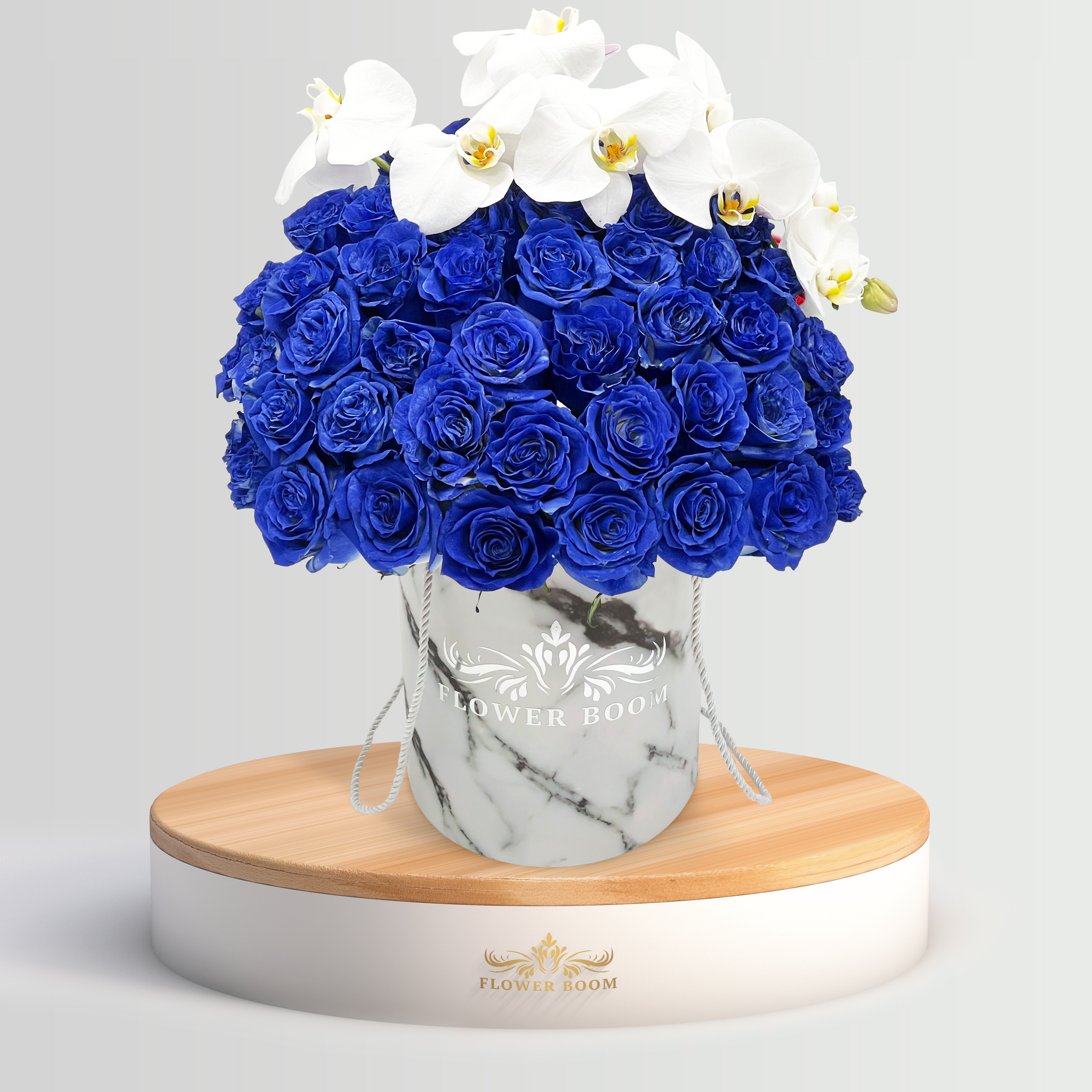 blue roses and white orchids in a box by Flower Boom San Francisco