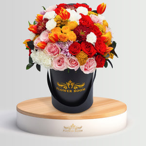 Autumn flowers in a black round box. Perfect for the Fall