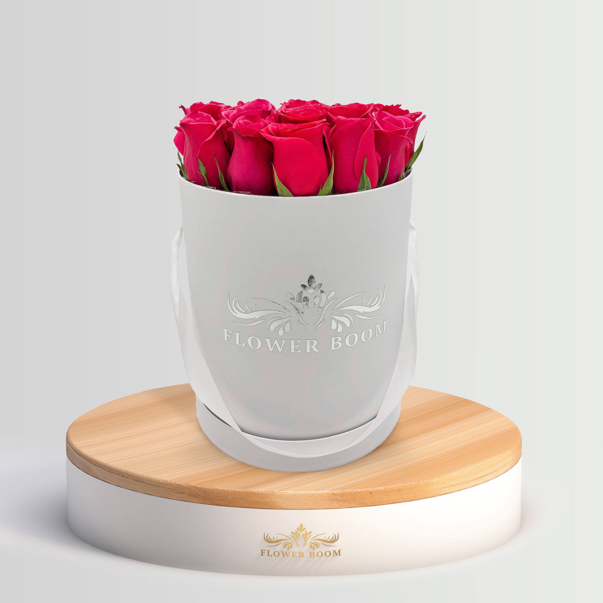 fuchsia hot pink roses in a white round box