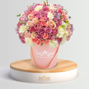 Flower Boom San Francisco Signature roses, pink spray roses, lisianthus & more in a pink round box