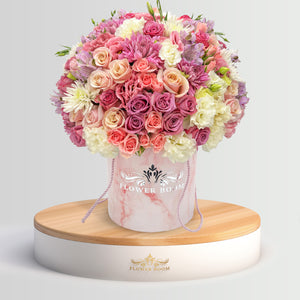 Flower Boom San Francisco Signature roses, pink spray roses, lisianthus & more in a pink marble round box