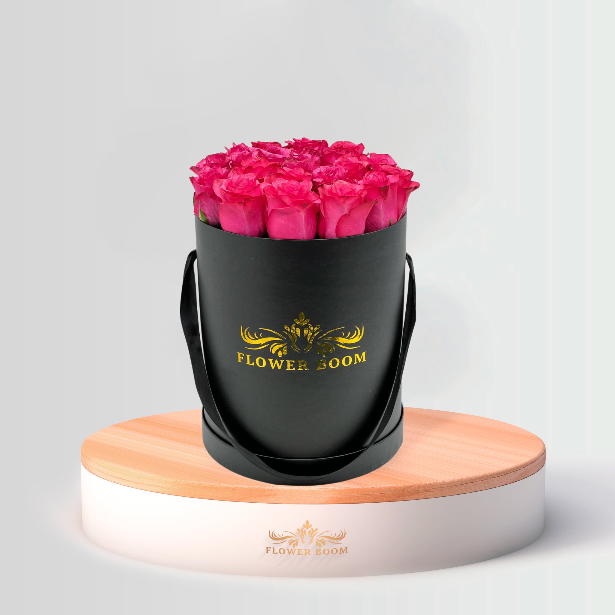 fuchsia hot pink roses in a round box