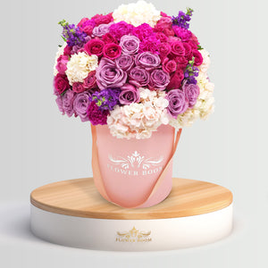 Fresh FbSF lavender, purple roses, blue hydrangeas, purple calla-lilies, violet & purple flowers in a pink round box