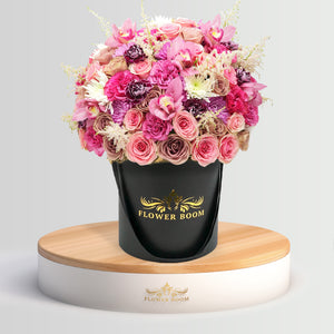 Signature pink roses, dahlias, tulips & other flowers in a box