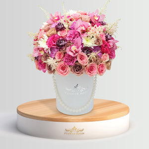 Signature pink roses, dahlias, tulips & other flowers in a box