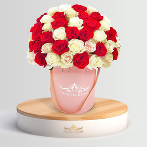 white red and light pink roses in a box