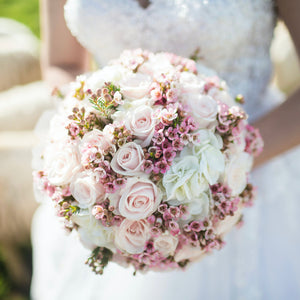 mood pink bridal bouquet from light pink roses and pink waxflower